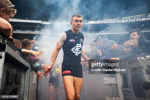 Patrick Cripps of the Blues leads his team out during the round 23 AFL match between the Carlton Blues and the Collingwood Magpies at Melbourne...