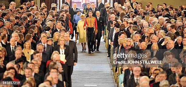 Britain's Queen Elizabeth II and Prince Philip, Duke of Edinburgh, walk into Westminster Hall in London on March 20, 2012 to receive Loyal Addresses...