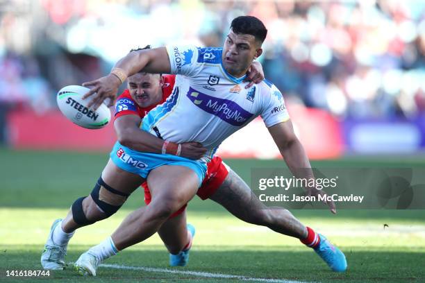 David Fifita of the Titans offloads during the round 23 NRL match between the St George Illawarra Dragons and the Gold Coast Titans at WIN Stadium on...