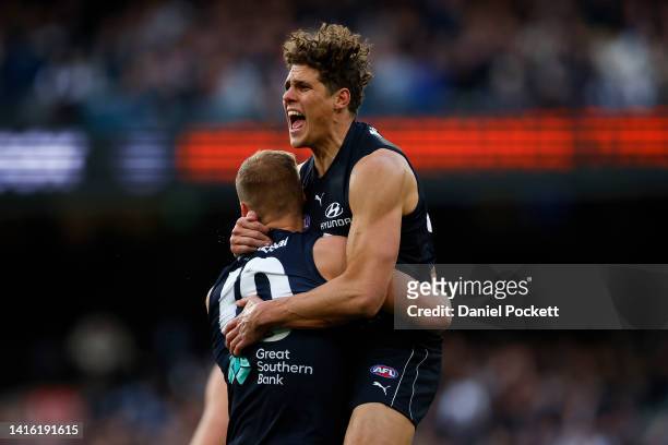 Charlie Curnow of the Blues celebrates with Harry McKay of the Blues afkicking a goal during the round 23 AFL match between the Carlton Blues and the...