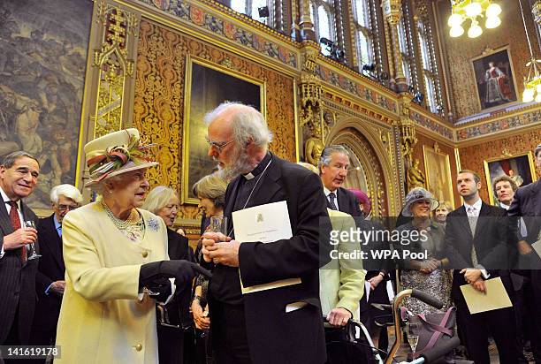 Queen Elizabeth II speaks with Archbishop of Canterbury Rowan Williams during a reception at the Houses of Parliament on March 20, 2012 in London,...