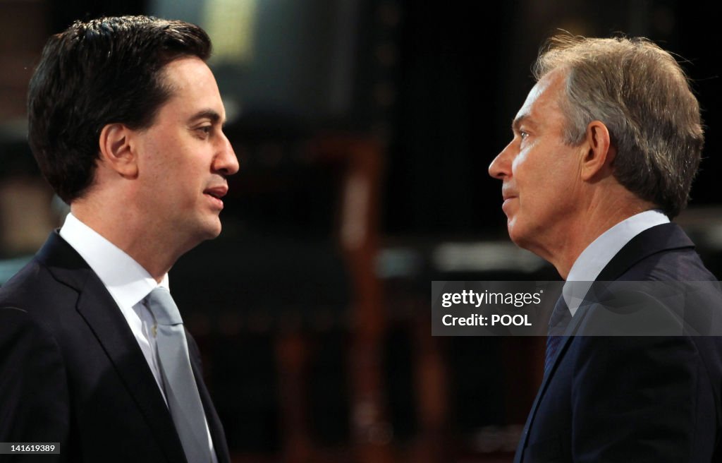 Former British prime minister Tony Blair talks with Britain's... News