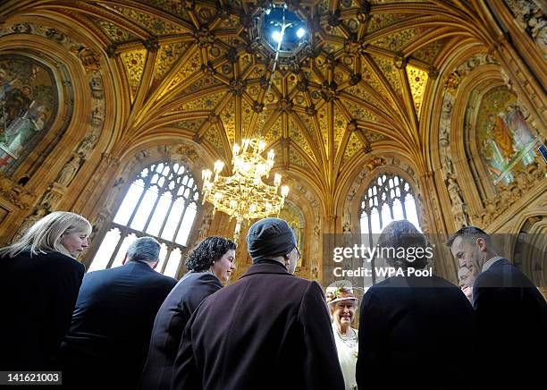 Queen Elizabeth II speaks with guests as she addresses both Houses of Parliament at Westminster Hall on March 20, 2012 in London, England. Following...