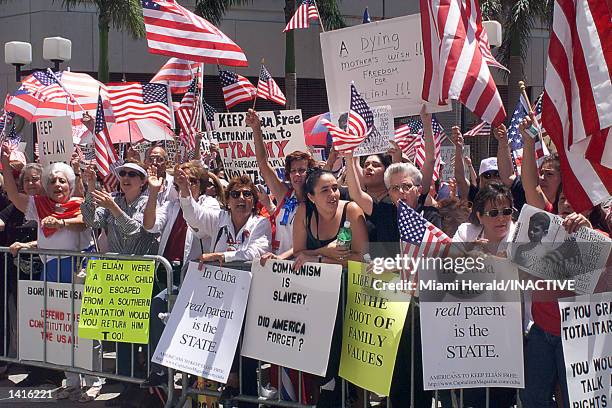 Hundreds of protesters wave flags at the "Americans for Elian''s Freedom" rally May 11, 2000 in front of the federal courthouse in Miami, demanding...