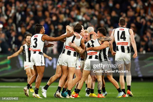 The Magpies celebrate on the final siren after winning the round 23 AFL match between the Carlton Blues and the Collingwood Magpies at Melbourne...