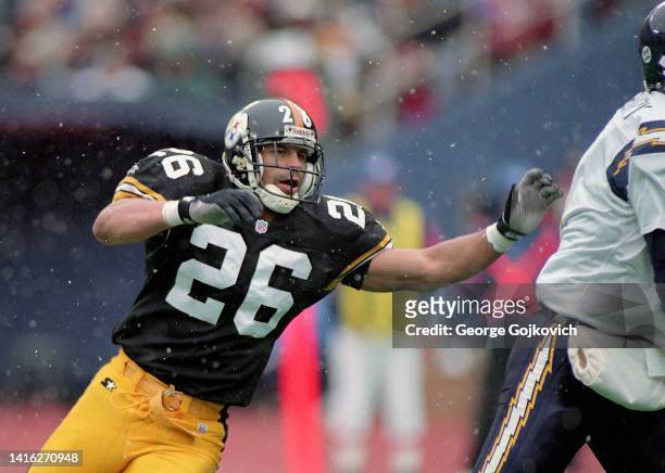 Cornerback Rod Woodson of the Pittsburgh Steelers pursues the play against the San Diego Chargers as snow falls during a game at Three Rivers Stadium...