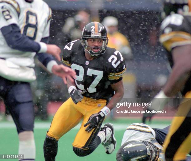 Cornerback Willie Williams of the Pittsburgh Steelers pursues the play against the San Diego Chargers as snow falls during a game at Three Rivers...