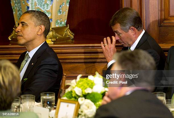 Speaker of the House John Boehner wipes tears from his face as he and U.S. President Barack Obama attend a luncheon for Irish Prime Minister Enda...