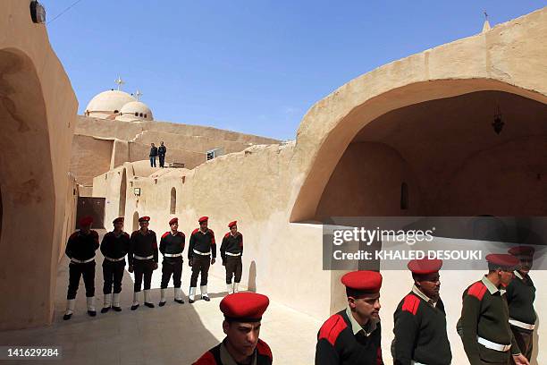 Egyptian military police stand guard outside the Bishoy Monastery during the funeral of Pope Shenuda III, the spiritual leader of the Middle East's...