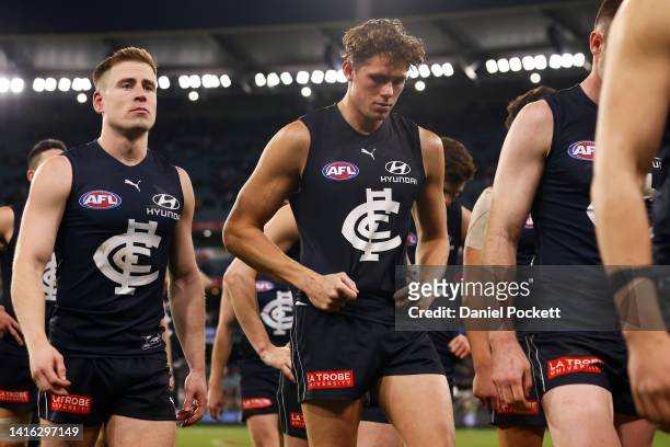 The Blues looks dejected after the round 23 AFL match between the Carlton Blues and the Collingwood Magpies at Melbourne Cricket Ground on August 21,...