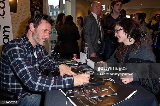 Director, Michel Hazanavicius signs autographs during 'The Artist' DVD signing session at FNAC Saint-Lazare on March 20, 2012 in Paris, France.