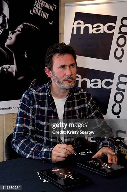 Director, Michel Hazanavicius signs autographs during 'The Artist' DVD signing session at FNAC Saint-Lazare on March 20, 2012 in Paris, France.