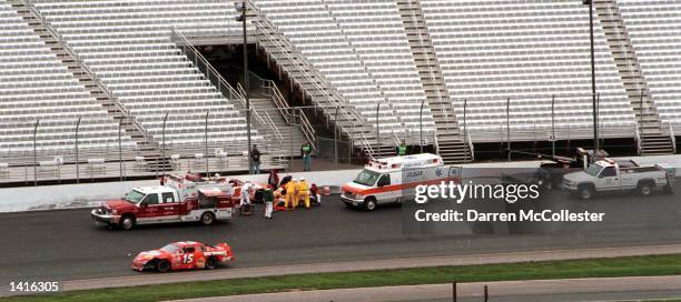 Busch Series driver Randy LaJoie is taken away in an ambulence after crashing at turn three at the New Hampshire International Speedway May 13, 2000...