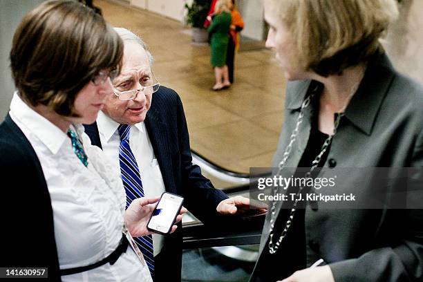 Sen. Carl Levin , center, talks with members of the press as Senate Democrats head to a weekly policy meeting at the Capitol on March 20, 2012 in...