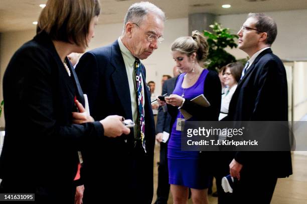 Sen. Chuck Grassley speaks with members of the press as Senate Republicans head to a weekly policy meeting at the Capitol on March 20, 2012 in...