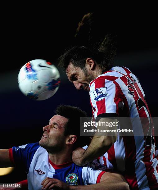 Scott Dann of Blackburn Rovers battles with Sotirios Kyrgiakos of Sunderland during the Barclays Premier League match between Blackburn Rovers and...