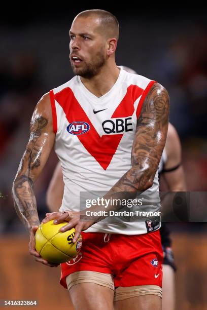 Lance Franklin of the Swans runs with the ball during the round 23 AFL match between the St Kilda Saints and the Sydney Swans at Marvel Stadium on...