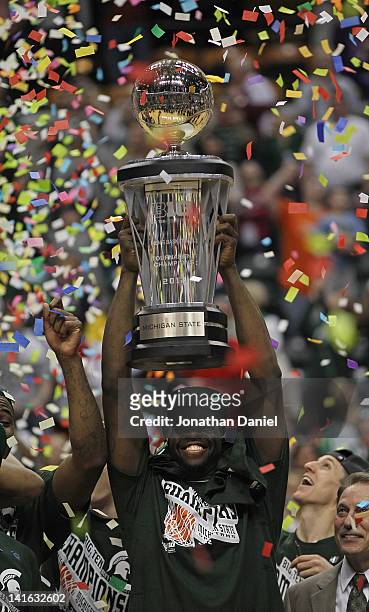 Draymond Gray of the Michigan State Spartans holds the trophy after a win against the Ohio State Buckeyes during the Final Game of the 2012 Big Ten...