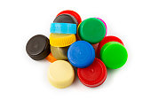olorful plastic caps on white background, recycle for environment concept. Separate wa