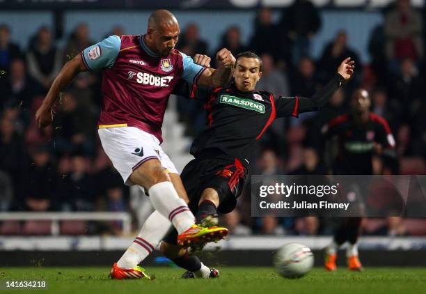 John Carew of West Ham shoots at goal as Seb Hines of Middlesbrough tries to block during the npower Championship match between West Ham United and...