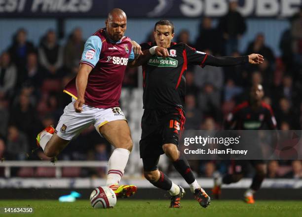 John Carew of West Ham goes to shoot at goal as Seb Hines of Middlesbrough tries to block during the npower Championship match between West Ham...