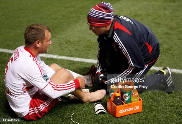 Teemu Tainio of New York Red Bulls is taped up by a trainer during a game against Real Salt Lake during the first half of an MLS soccer game March...