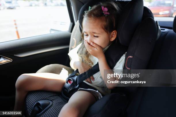 little girl suffers from motion sickness in car - sick child stockfoto's en -beelden