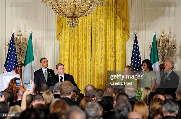 Irish Prime Minister Enda Kenny makes remarks as U.S. President Barack Obama listens along with first lady Michelle Obama , Kenny's wife Fionnuala...