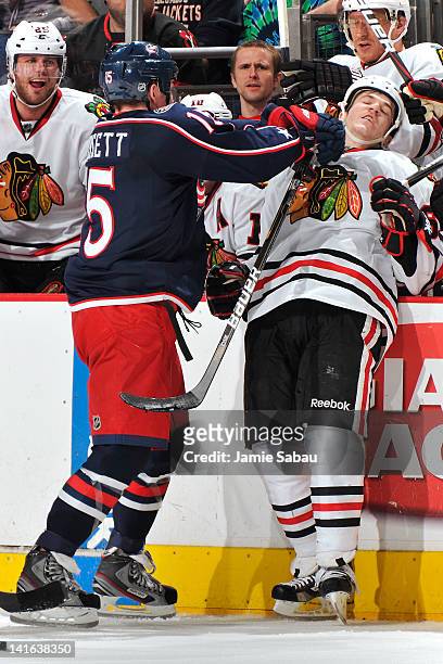 Derek Dorsett of the Columbus Blue Jackets is called for roughing after hitting Andrew Shaw of the Chicago Blackhawks during the second period on...
