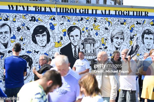 Fans of Leeds United gather outside the stadium in front of a mural prior to kick off of the Premier League match between Leeds United and Chelsea FC...