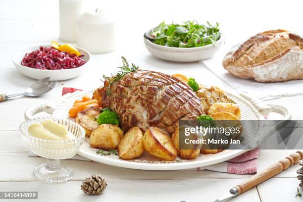 roast meat and potatoes, with salad and mayo - roast pig stock pictures, royalty-free photos & images