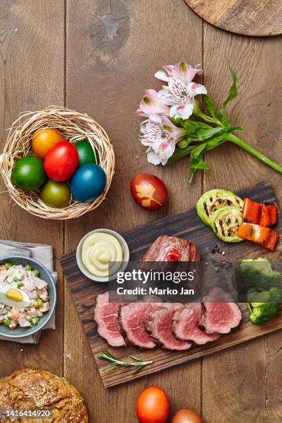 beef stake lunch served with salad and easter eggs - easter dinner stock pictures, royalty-free photos & images