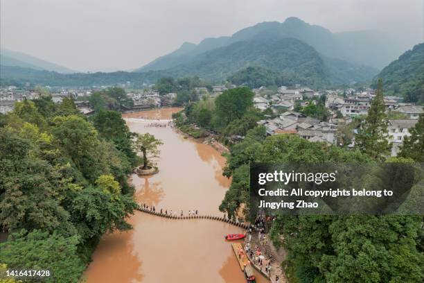 overlooking an ancient water town in summer holiday of sichuan - rainy season stock pictures, royalty-free photos & images