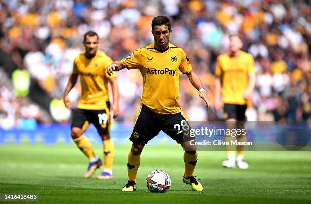 Joao Mouthino of Wolverhampton Wanderers in possesion during the Premier League match between Tottenham Hotspur and Wolverhampton Wanderers at...