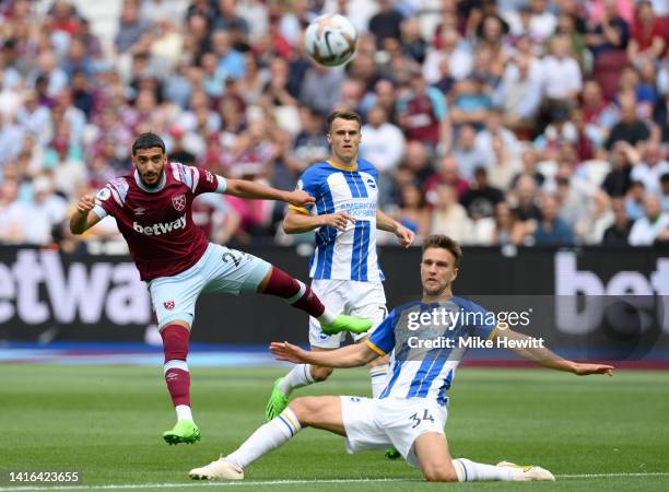 Said Benrahma of West Ham United has a shot on goal whilst under pressure from Joel Veltman of Brighton & Hove Albion during the Premier League match...