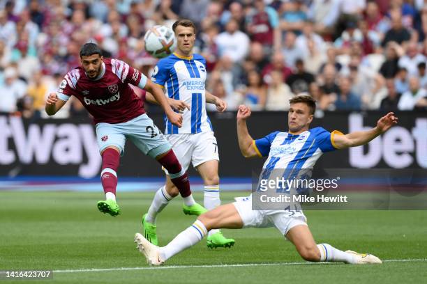 Said Benrahma of West Ham United has a shot on goal whilst under pressure from Joel Veltman of Brighton & Hove Albion during the Premier League match...