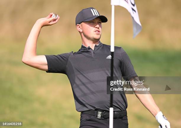 Richard Mansell of England throws his ball to his caddy on the 10th hole during Day Four of the D+D Real Czech Masters at Albatross Golf Resort on...