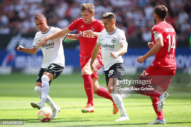 Mario Goetze of Eintracht Frankfurt challenges Luca Jannis Kilian of 1. FC Köln whilst under pressure from Rafael Santos Borre during the Bundesliga...