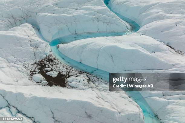 An aerial view of meltwater lakes formed at the Russell Glacier front, part of the Greenland ice sheet in Kangerlussuaq, Greenland, on August 16,...