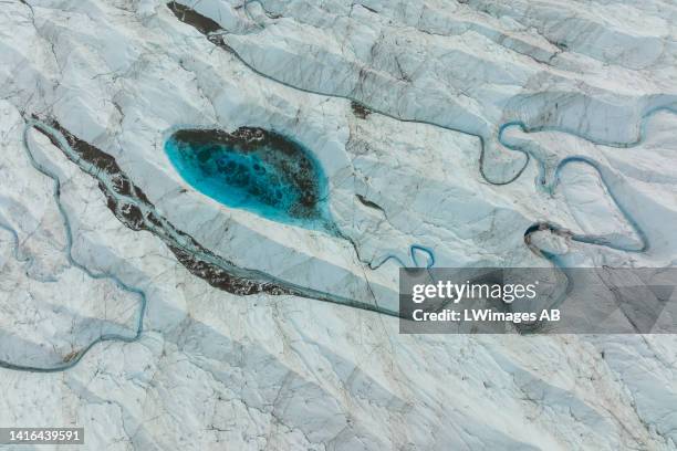 An aerial view of meltwater lakes formed at the Russell Glacier front, part of the Greenland ice sheet in Kangerlussuaq, Greenland, on August 16,...