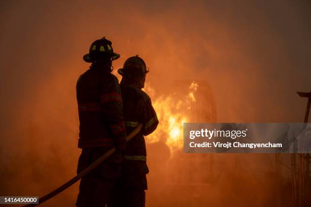 firefighters team working - inferno stock pictures, royalty-free photos & images