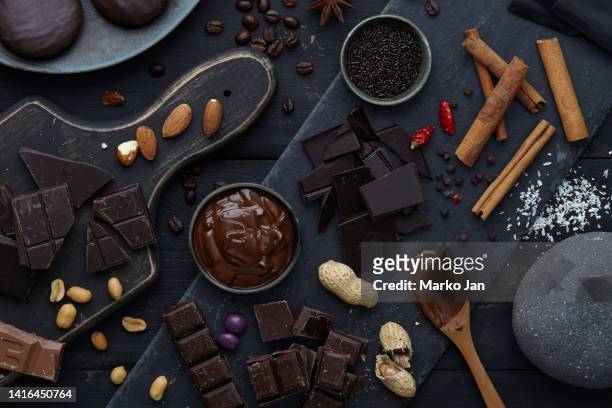 dark mood chocolate pieces - almond caramel stock pictures, royalty-free photos & images
