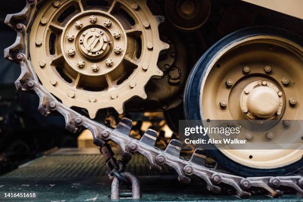 close up of military tank tracks and wheels while being transported - defense industry photos et images de collection