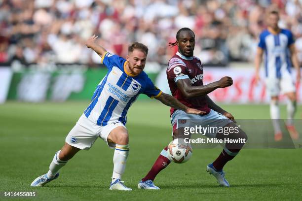 Alexis Mac Allister of Brighton & Hove Albion is challenged by Michail Antonio of West Ham United during the Premier League match between West Ham...