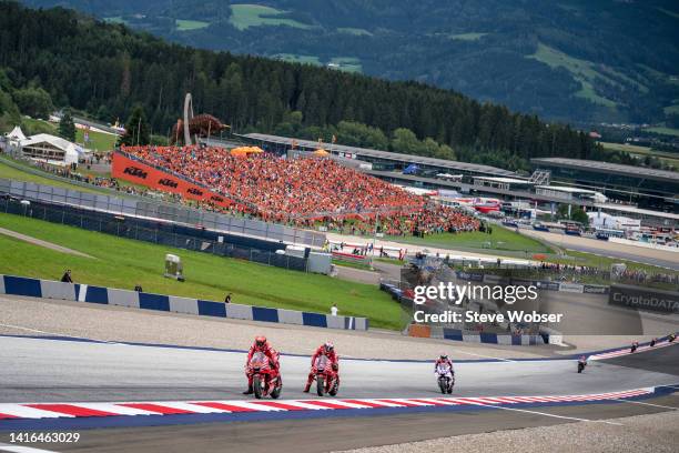 Francesco Bagnaia of Italy and Ducati Lenovo Team rides in front of the MotoGP field during the race of the CryptoDATA MotoGP of Austria at Red Bull...