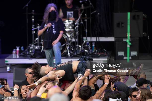 Crowd surfing during the Adolesents performance at the Punk in Drublic Craft Beer & Music Festival at Fiddler's Green Amphitheatre on August 20, 2022...