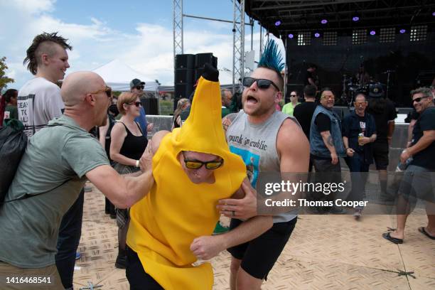 Fans in the mosh pit at the Punk in Drublic Craft Beer & Music Festival at Fiddler's Green Amphitheatre on August 20, 2022 in Englewood, Colorado.