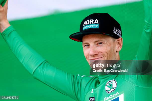 Sam Bennett of Ireland and Team Bora - Hansgrohe celebrates winning the Green Points Jersey on the podium ceremony after the 77th Tour of Spain 2022,...