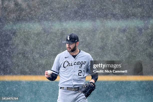 Rain falls as Lucas Giolito of the Chicago White Sox warms up prior to a game against the Cleveland Guardians at Progressive Field on August 21, 2022...