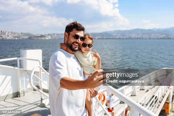 father with daughter taking selfie - cruise ship family stock pictures, royalty-free photos & images